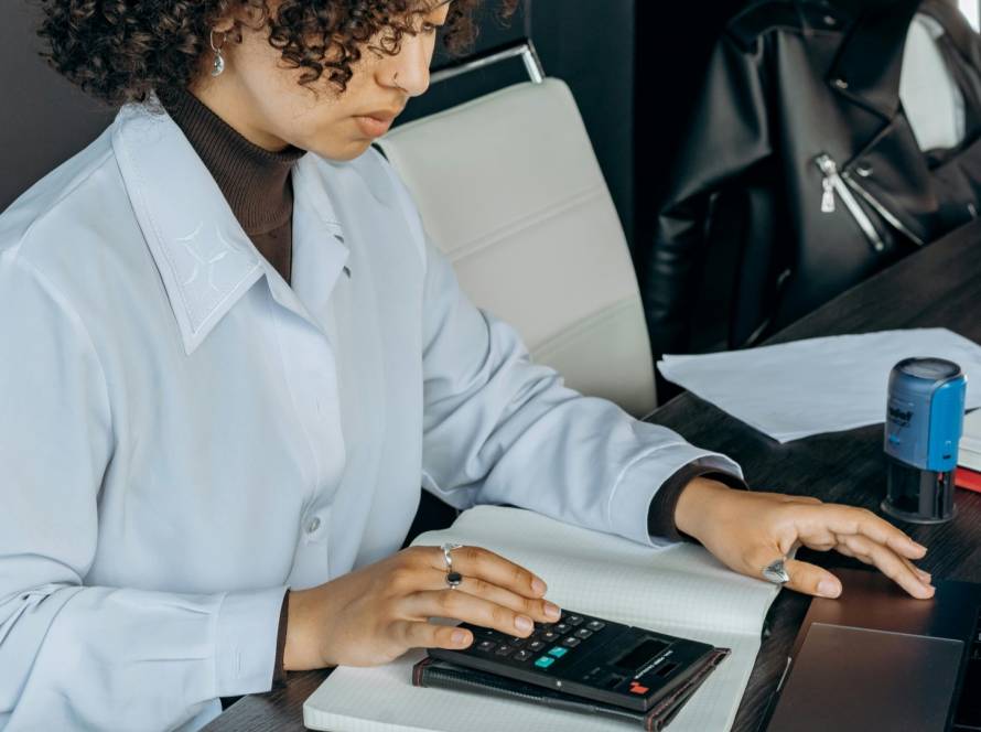 Small business women working on tax documents.