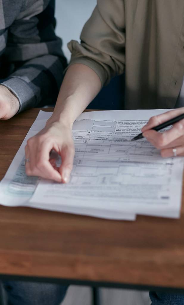 Two people reviewing their tax forms.