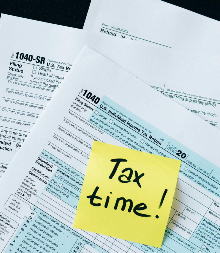 A stack of Tax Documents with a note stating "Tax Time!"