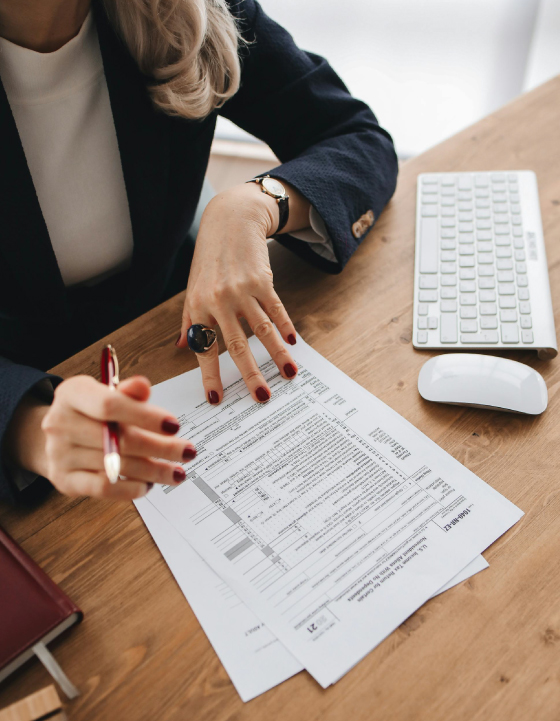 Business woman working on individual tax documents.